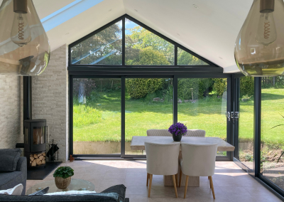 extension to the home with 2 sets of large black bi-fold doors