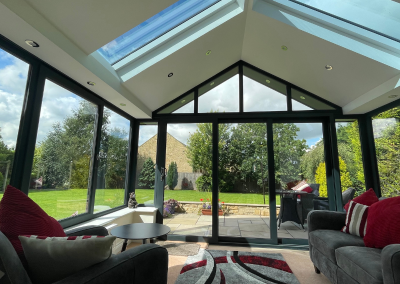 large sunroom with big windows with black edging