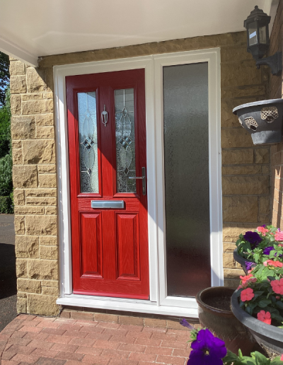 red front door with stained glass details