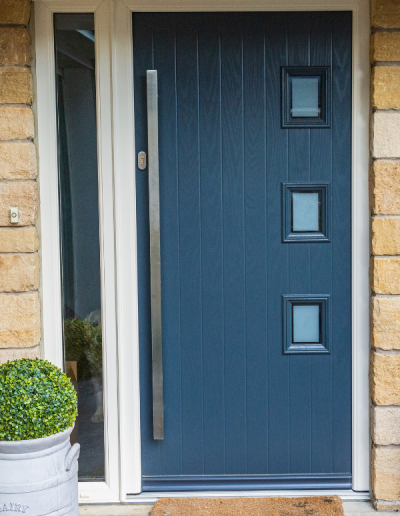 navy entrance door with 3 small frosted glass windows