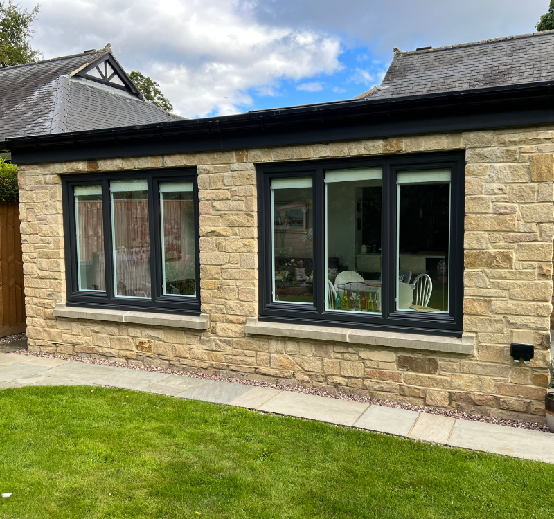 Hawthorns Windows 2 sets of black windows set into 3 panels