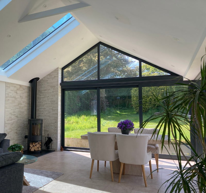 Sunroom with large windows leading onto garden