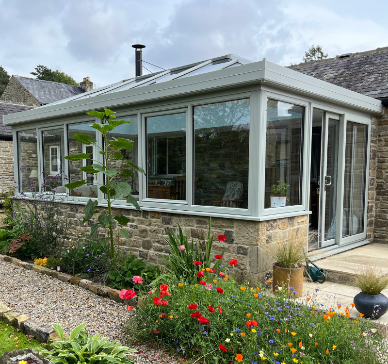 conservatory with grey trim and large windows