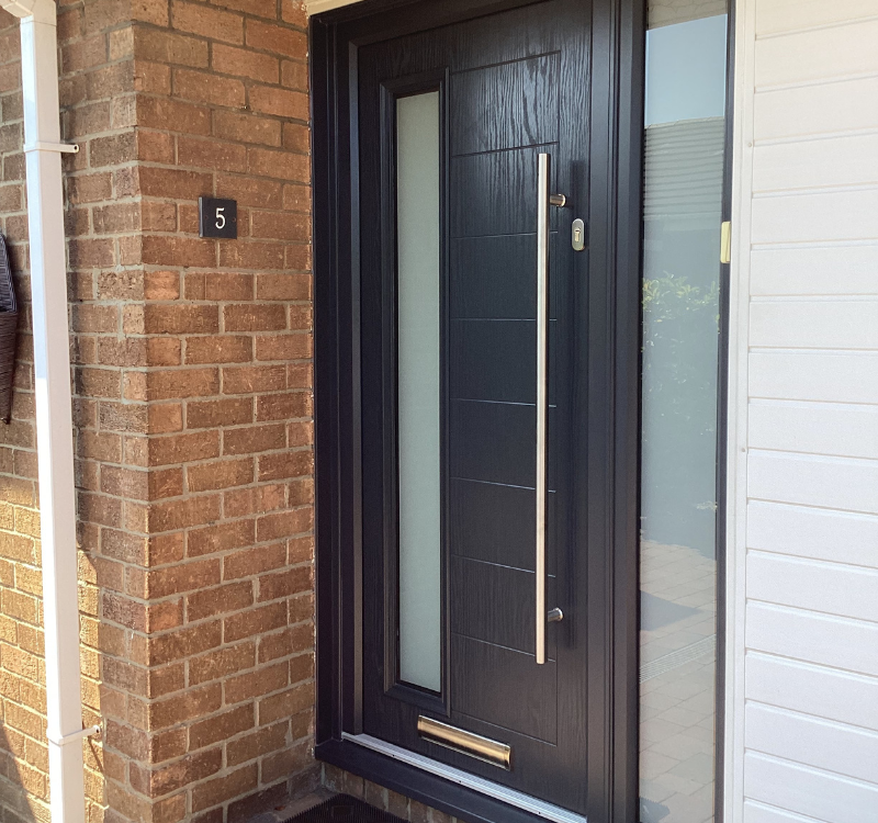 entrance door with large handle and long window