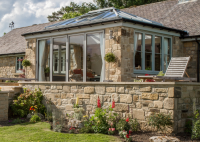 sunroom with large windows and bi-fold doors