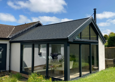 black trim bi fold doors with Hawthorns Roofline Solutions