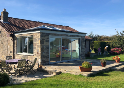 sunroom with large sliding door