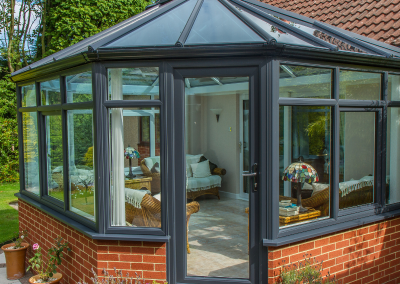 A black and orange brick conservatory