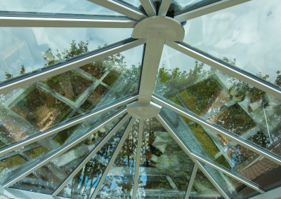 A glass conservatory roof from the inside