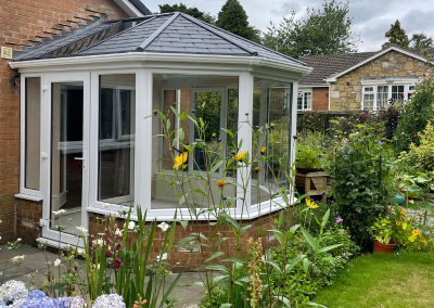 A glass conservatory with door