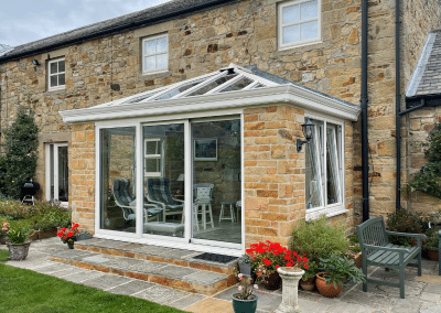 A sandstone and glass conservatory