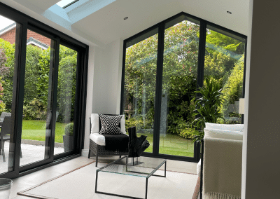 The inside of a sunroom with an angles skylight