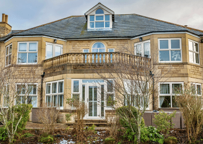 An impressive house with a large variation of windows and patio doors