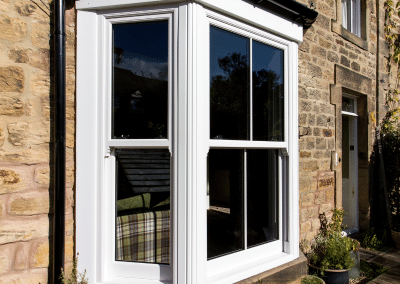 A bay window in a sandstone building