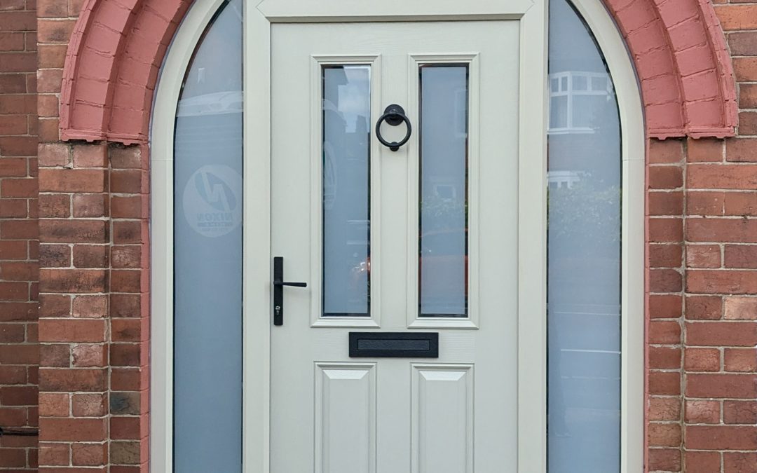 A composite door surrounded in glass, supplied and fitted by Hawthorns Windows