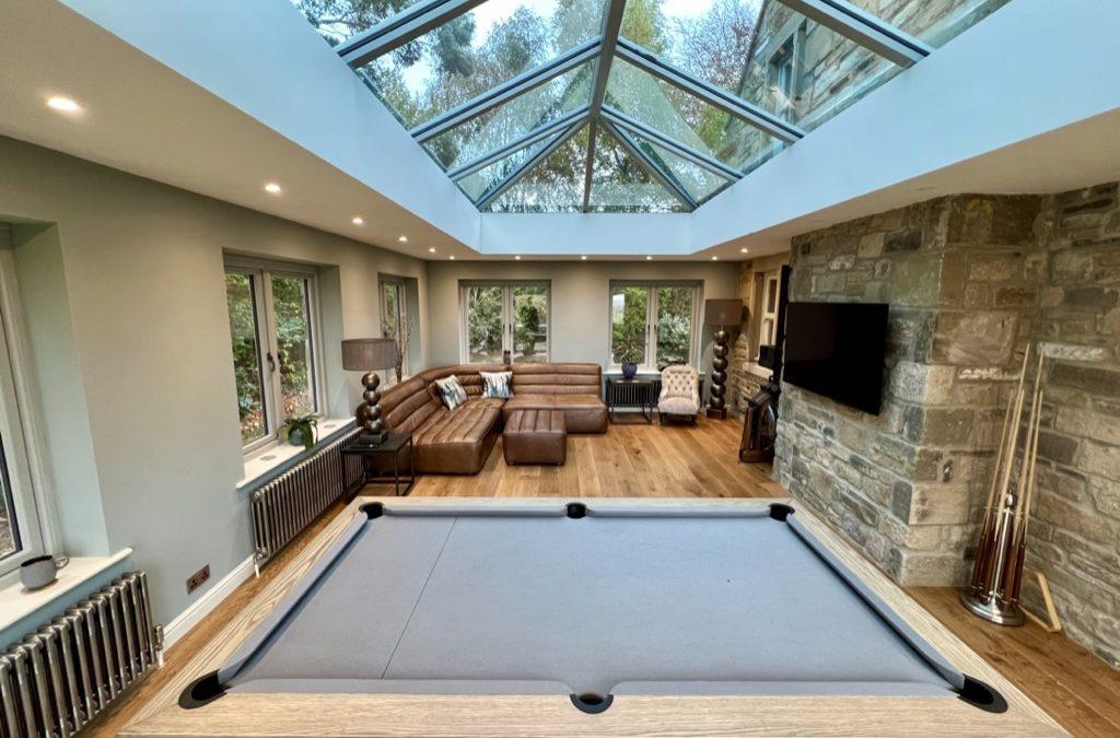 Modern orangery styles have moved well beyond the classical columns and period detailing that defined the traditional form.